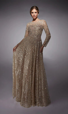 A woman wears the Alyce 27757 long formal dress—full-length, long-sleeved, and covered in gold sequins—making it a chic mother-of-the-bride look against a plain gray background.