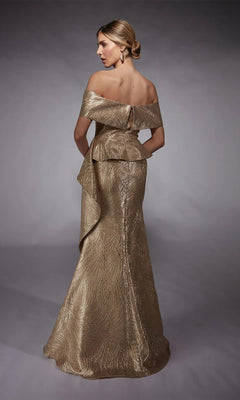 A woman models the Alyce 27759 long formal dress—a gold, off-the-shoulder jacquard gown with textured patterns and a fitted bodice—against a plain studio backdrop.