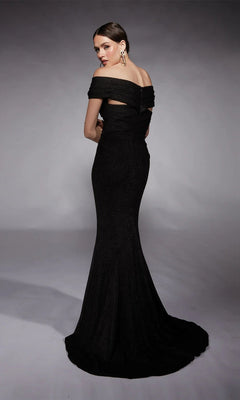 A woman stands with her back partially turned, modeling the Alyce 27767 long formal dress—a floor-length black off-the-shoulder gown—against a plain gray background.