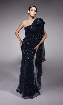 A woman models the Alyce 27771 Long Formal Dress in navy—a floor-length, one-shoulder sequin gown with draped side detail—standing against a plain gray background, highlighting its elegant evening style.