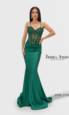 A woman wears the Jessica Angel 2778 long prom dress in hunter, featuring a fitted silhouette, floor-length skirt, sheer beaded corset bodice, and delicate spaghetti straps.