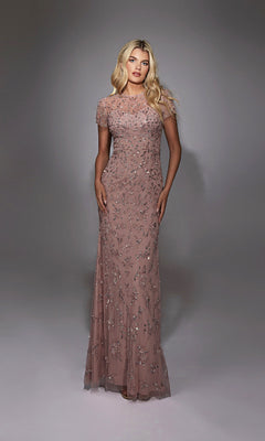 A woman models the Alyce 27789 long formal dress, a floor-length mauve gown with intricate silver beadwork, posing against a softly lit neutral backdrop.