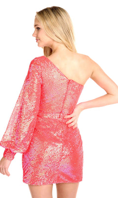 A woman stands facing away with one hand on her hip, wearing the One-Sleeve Short Sequin Party Dress 27790 featuring shiny pink sequins and a puffy sleeve.