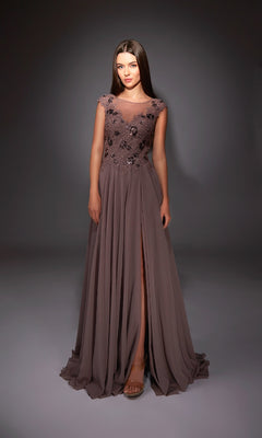 A woman poses gracefully in the Alyce 27842 long formal dress—mauve chiffon, A-line silhouette, floral embellished bodice, and a high skirt slit—set against a dark background.
