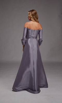 A woman in the Alyce 27859 long formal dress—an off-the-shoulder, floor-length silver-gray gown—stands with her back to the camera against a plain gray background, making an elegant mother-of-the-bride choice.