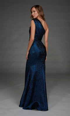 Wearing the Alyce 27885 Long Formal Dress in dark blue, a woman stands with her back slightly turned, gazing over her shoulder.