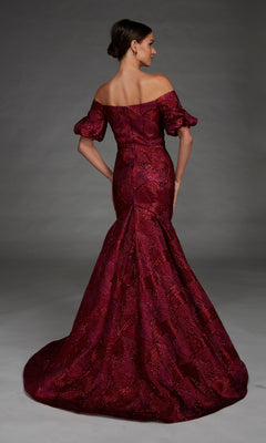 A woman stands against a plain gray background, facing away from the camera, wearing the Alyce 27889 long formal dress. This off-the-shoulder mermaid gown in burgundy features a sweetheart neckline and textured jacquard patterns that elegantly accentuate her silhouette with its fitted mermaid skirt.