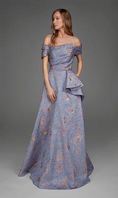 A woman wearing the Alyce 27893 long formal dress in light periwinkle, featuring a floral jacquard design with a fitted bodice, off-the-shoulder straps, side draping, and a floor-length skirt, stands against a plain gray background.