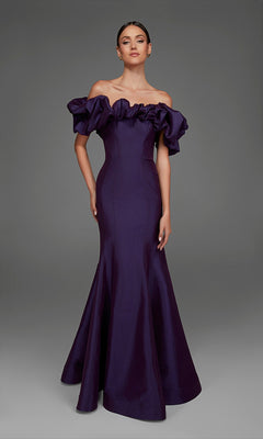 A woman wearing the Alyce 27895 long formal dress in plum, featuring an off-the-shoulder ruffled neckline and a subtle mermaid skirt, poses against a plain gray background.