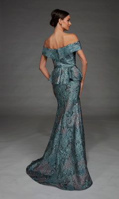 A woman wearing the Long Formal Dress: Alyce 27899, which features an off-the-shoulder neckline and a structured peplum waist, crafted from textured metallic teal fabric, stands in a studio with a plain gray background.