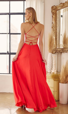 A woman in the Strappy-Back Simple Long A-Line Prom Dress 278 stands indoors, holding out the skirt near a large window and a decorative mirror.