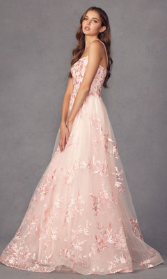 A woman poses gracefully against a plain gray background wearing the Embroidered-Lace Long A-Line Prom Ball Gown 279, a light pink floor-length dress with delicate floral embroidery.