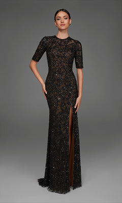 A woman stands against a plain gray background, wearing the Long Formal Dress: Alyce 27901 in Black/Blush—a beaded, floor-length evening gown with short sleeves, a thigh-high front slit, and a fitted column silhouette.