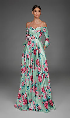 A woman wearing the Long Formal Dress: Alyce 27910 in pistachio stands against a plain gray background. This off-the-shoulder, floor-length mikado A-line dress creates an elegant and timeless look.