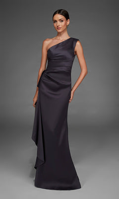 A woman stands against a gray background wearing the Alyce 27913 long formal dress in charcoal, a one-shoulder, floor-length gown with draped detailing and minimal accessories.
