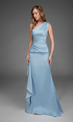 A woman wearing the Alyce 27913 long formal dress—a light blue satin gown featuring a one-shoulder neckline and draped detailing—stands against a gray background. This elegant dress beautifully combines sophistication with modern style.