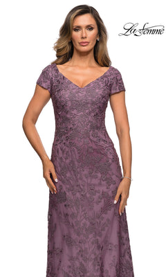 Woman in a mauve, short-sleeve, embroidered lace Long Formal Dress: La Femme 27915 with V-neckline, standing against a white background.
