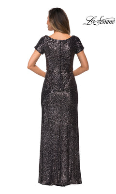 Back view of a woman wearing a La Femme 27916 floor-length sequin formal dress with short sleeves.