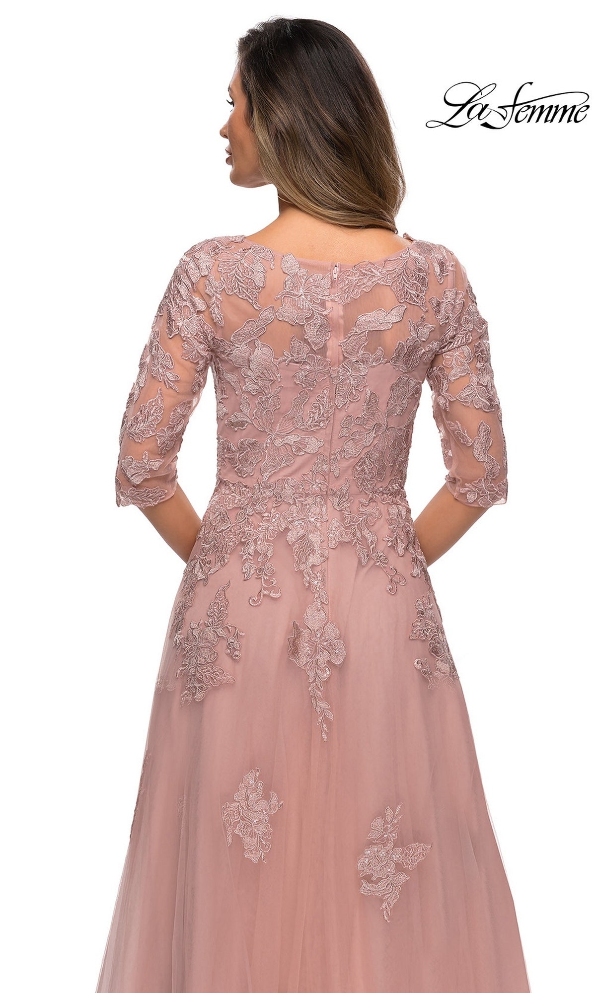 Back view of a dusty rose, floor-length La Femme 27922 mother-of-the-bride dress with three-quarter sleeves and a floral lace overlay.
