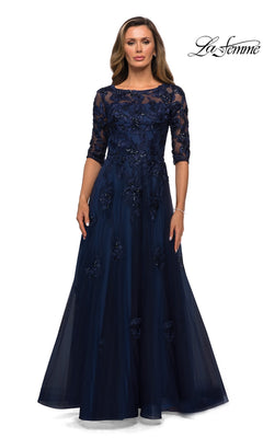 A navy Long Formal Dress: La Femme 27922 featuring three-quarter sleeves, a boat neckline, and floral lace embellishments on the bodice and skirt.