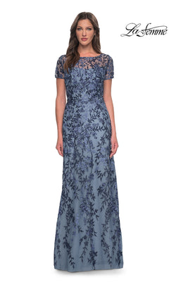 Woman wearing Long Formal Dress: La Femme 27956 in slate, a floor-length, short-sleeve lace gown with floral beading, against a white background. “La Femme” logo in the top right.