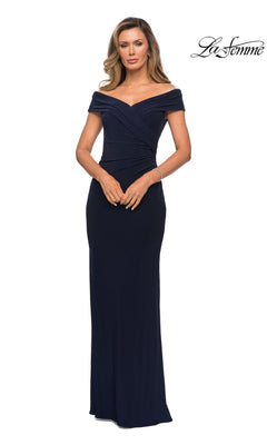 A woman wears the Long Formal Dress: La Femme 27959 in navy, featuring an off-the-shoulder ruched jersey bodice and floor-length fit. “La Femme” logo appears top right.