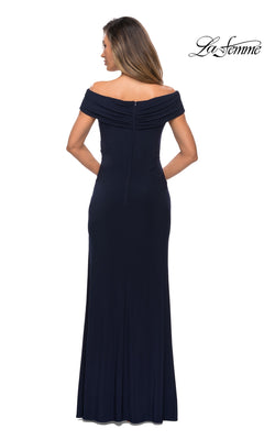 Woman facing away in a floor-length, off-the-shoulder navy “Long Formal Dress: La Femme 27959” with short sleeves and visible back zipper. “La Femme” logo in corner.