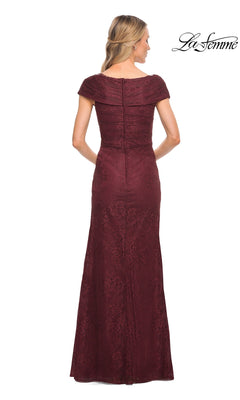 A woman is shown from the back wearing the Long Formal Dress: La Femme 27982—a floor-length, off-the-shoulder burgundy gown with an elegant lace texture. The fitted bodice and visible zipper enhance its refined mother of the bride style. The “La Femme” logo appears in the top right corner.