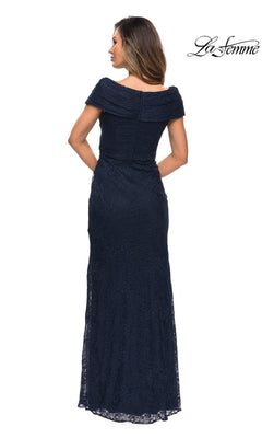 A woman is shown from the back wearing the La Femme 27982 long formal dress, an off-the-shoulder, floor-length navy lace mother of the bride gown. The “La Femme” logo appears in the top right corner.