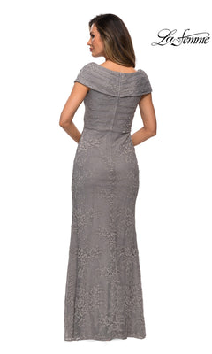A woman is shown from the back wearing the Long Formal Dress: La Femme 27982, a floor-length gray lace mother of the bride gown with short sleeves. The dress features a fitted silhouette and an elegant off-the-shoulder neckline. The “La Femme” logo appears in the corner.