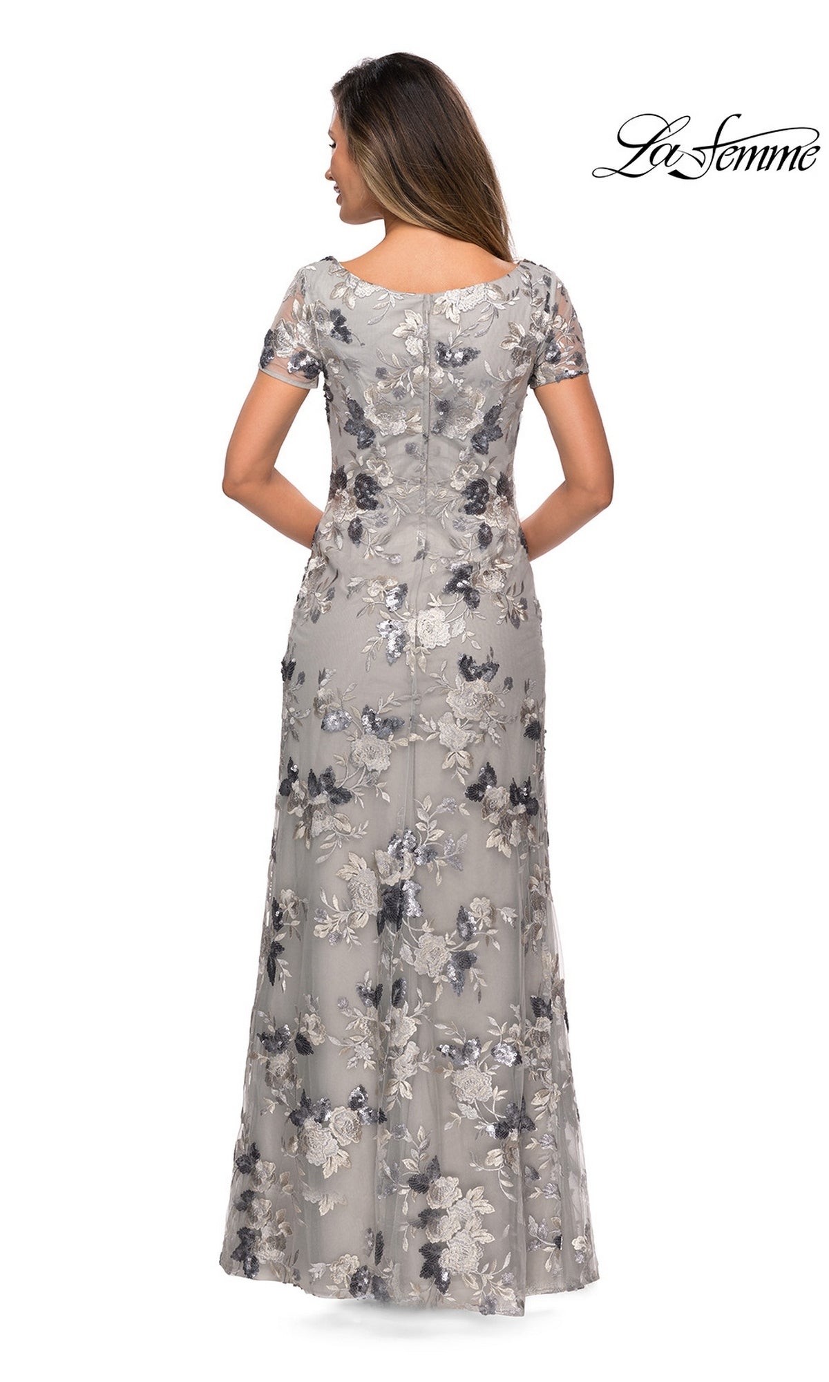 Back view of the Long Formal Dress: La Femme 27991, a floor-length silver gown with short sleeves and floral sequin embroidery.