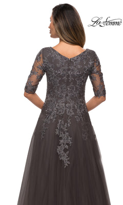 Back view of the Long Formal Dress: La Femme 27993, a grey floor-length A-line gown with three-quarter length sleeves and floral lace appliques over a sheer bodice.