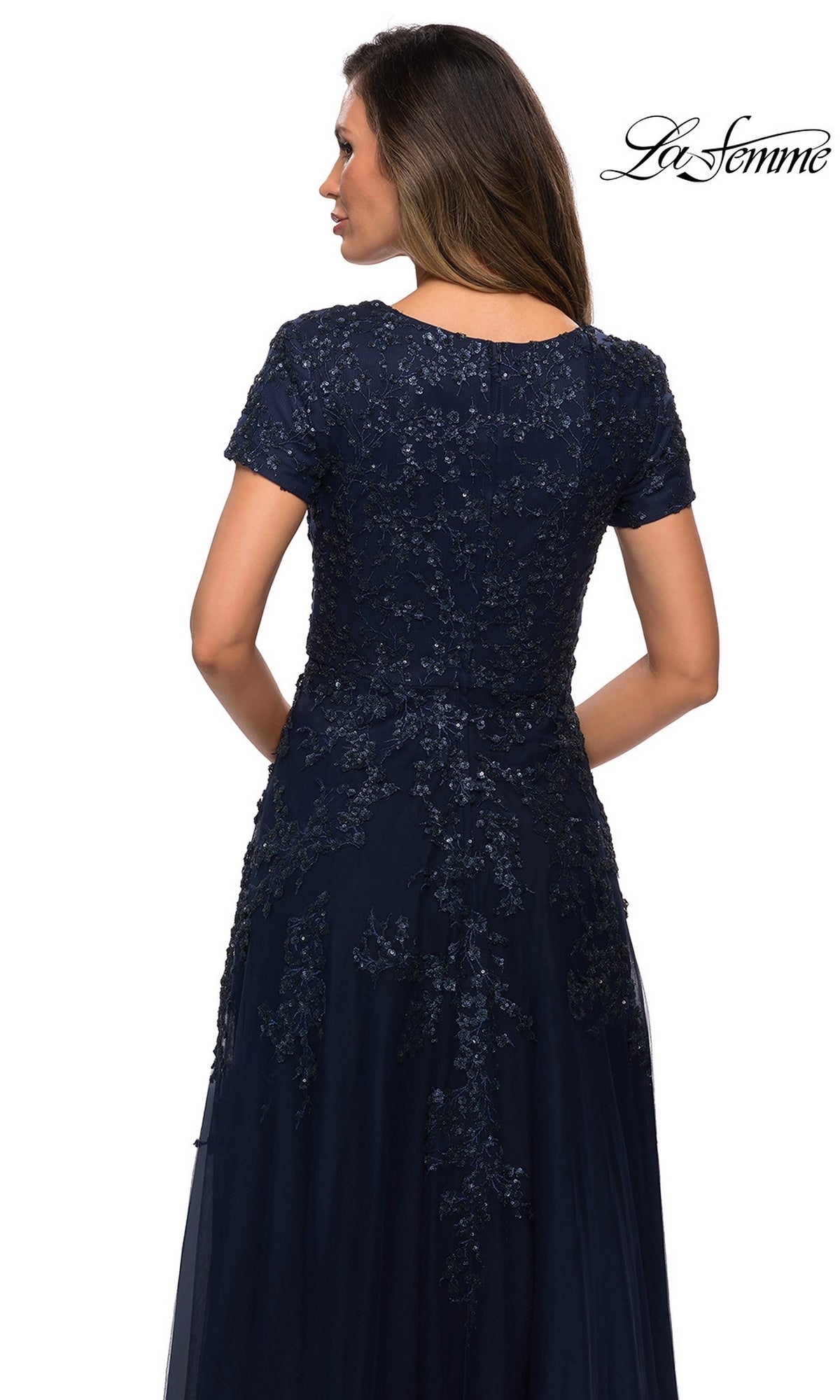 Back view of a navy blue Long Formal Dress: La Femme 28037 featuring a short-sleeved bodice with sequined floral embroidery and a floor-length A-line tulle skirt.