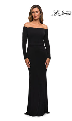 Woman wearing the Long Formal Dress: La Femme 28054 in black with a sheath silhouette and long sleeves, standing against a white background with the “La Femme” logo in the corner.