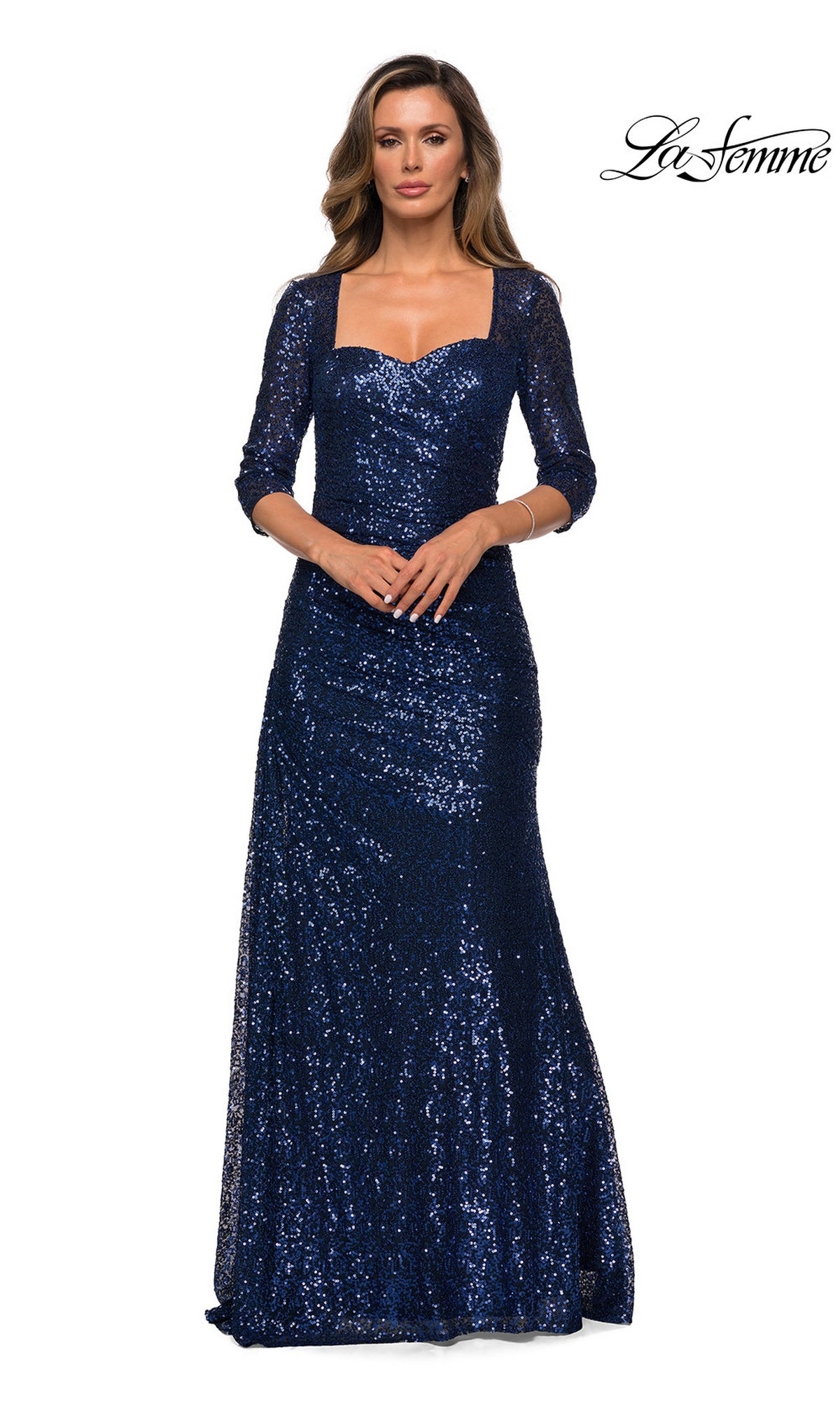 Woman wearing the Long Formal Dress: La Femme 28065 in navy, with sequins and three-quarter sleeves, perfect for formal events or as a mother of the bride gown.