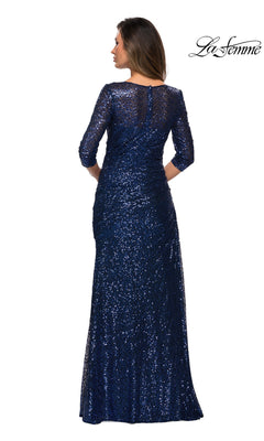Woman wearing Long Formal Dress: La Femme 28065, a navy blue, sequin, floor-length gown with long sleeves, seen from the back on a white background.