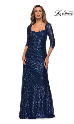 Woman wearing Long Formal Dress: La Femme 28065—navy blue sequins, three-quarter sleeves, square neckline. Perfect mother of the bride look. “La Femme” logo in top right.