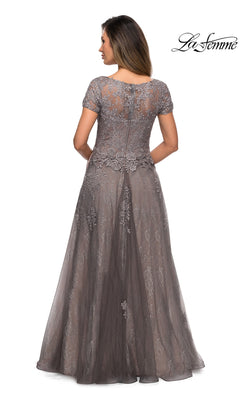Back view of a floor-length platinum La Femme 28091 formal dress featuring short sleeves and a floral lace overlay.