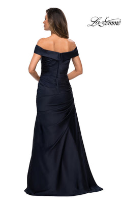 A woman is seen from the back, wearing the Long Formal Dress: La Femme 28103—a fitted, off-the-shoulder, floor-length black gown with an elegant neckline—against a white background, with the “La Femme” logo displayed in the top right corner.