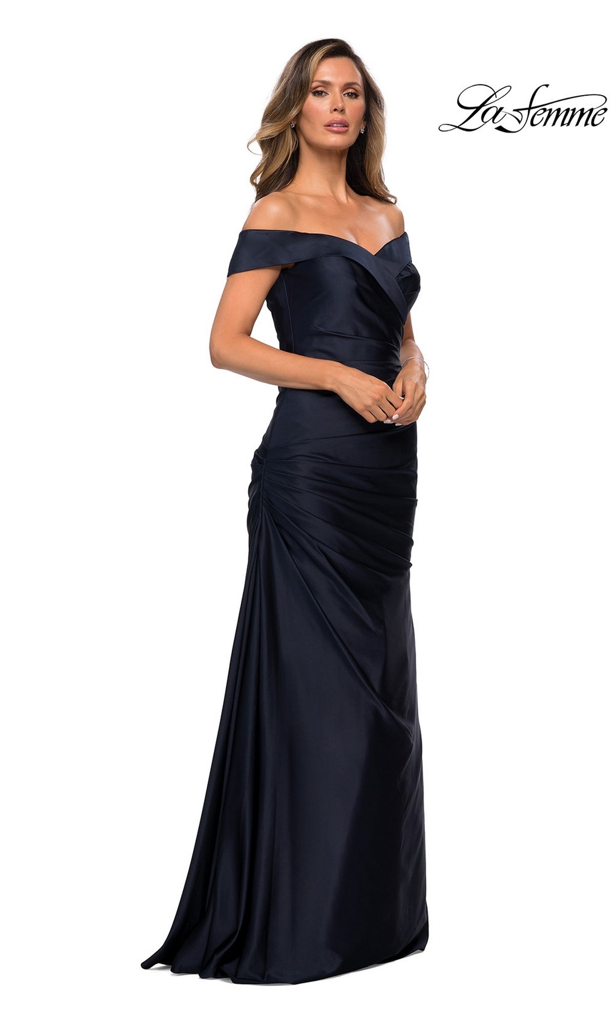 Woman wearing the La Femme 28103 long formal dress, featuring a satin finish, elegant ruched detailing, and an off-the-shoulder neckline, standing against a white background—an ideal choice for a classic mother-of-the-bride dress.
