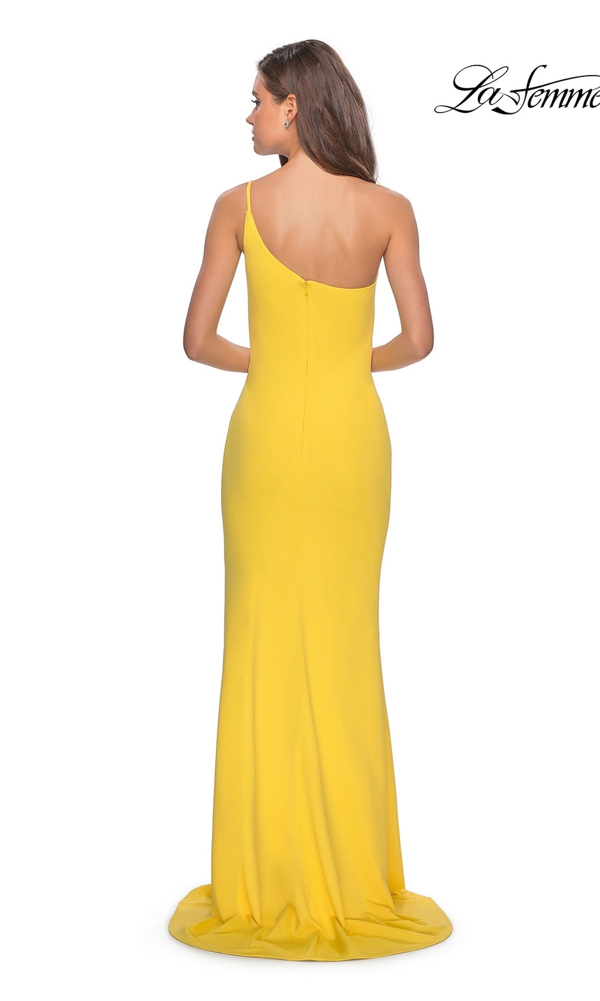 A woman wears the La Femme One-Shoulder Long Formal Dress 28176—a yellow, fitted evening gown with a small train, zipper closure, and one-shoulder design, shown from the back.