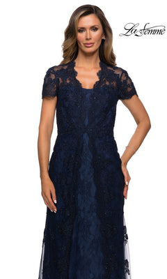 Long Formal Dress: La Femme 28195 in navy blue, featuring a scalloped lace design, short sleeves, and a V-neckline.