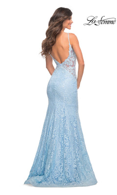 Woman in the La Femme Backless Long Lace Prom Dress 28355—light blue, mermaid skirt, open back—stands looking over her shoulder. "La Femme" logo appears in the top right corner.
