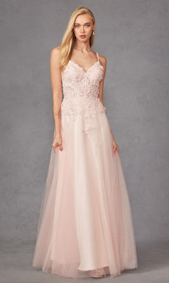 A woman models the Long Prom Dress 283 by Juliet—a sleeveless, floor-length blush pink A-line gown with floral lace embroidery and a tulle skirt—against a gray background.