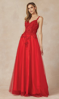 A woman stands wearing the Long Prom Dress 283 by Juliet, a floor-length, sleeveless red A-line gown with floral lace embroidery on the bodice and a graceful V-neckline, set against a neutral background.