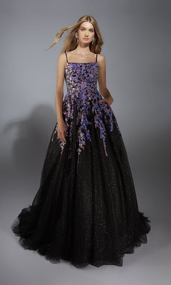 A woman in the Aerie Couture 283 long formal dress, featuring thin straps and embellished floral details, poses against a plain gray background.