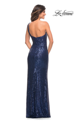 A woman models the La Femme One-Shoulder Long Sequin Prom Dress 28401 in navy, floor-length and shimmering, shown from the back with the La Femme logo in the top right.