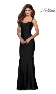 A woman models the La Femme Simple Long Prom Dress 28568 in black, featuring a fitted silhouette and thin straps, against a plain white background with the La Femme logo in the top right corner.