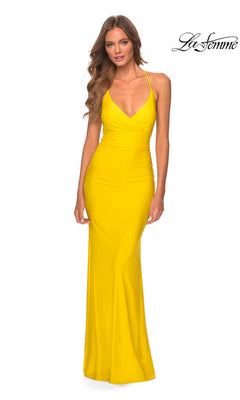 A woman models the La Femme Empire-Waist Tight Long Prom Dress 28593, a long, fitted bright yellow gown with thin straps, standing against a plain white background. The La Femme logo is in the top right corner.