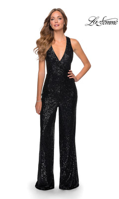 A woman models the La Femme Long Sequin Prom Jumpsuit 28719—sleeveless, black, with a deep V-neckline—against a plain white background. The La Femme logo is displayed in the top right corner.